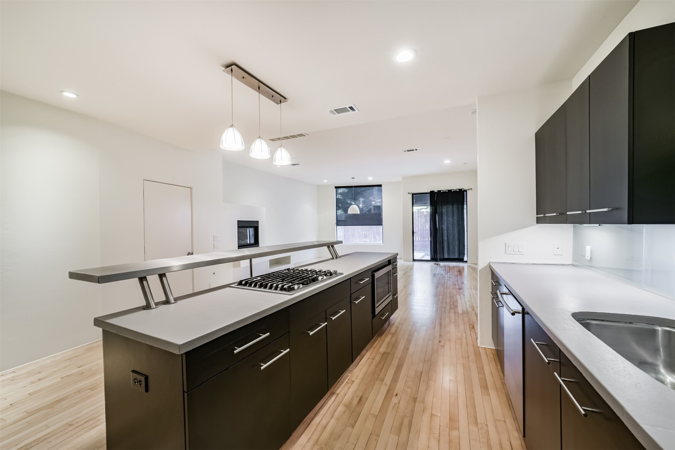 2518 Mason Street, Unit B Houston, TX 77006 - Photo 10 of 40 a kitchen with a stove sink and cabinets