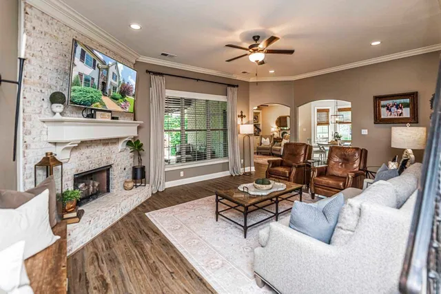 a living room with furniture and a fireplace