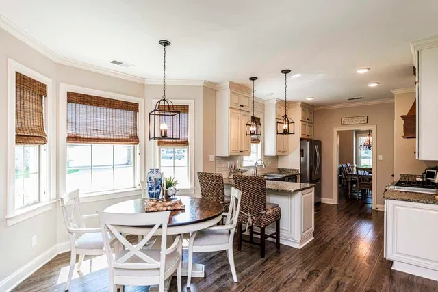 a view of a dining room with furniture window and wooden floor