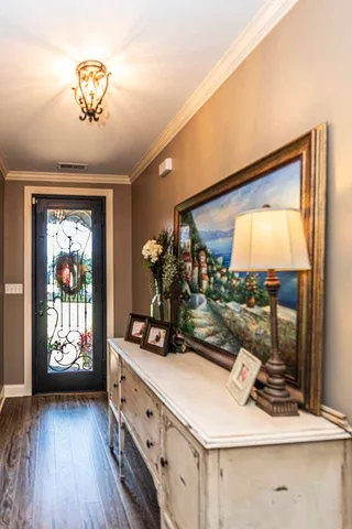a view of living room with furniture and a flat screen tv