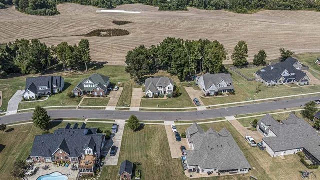 an aerial view of a house with outdoor space