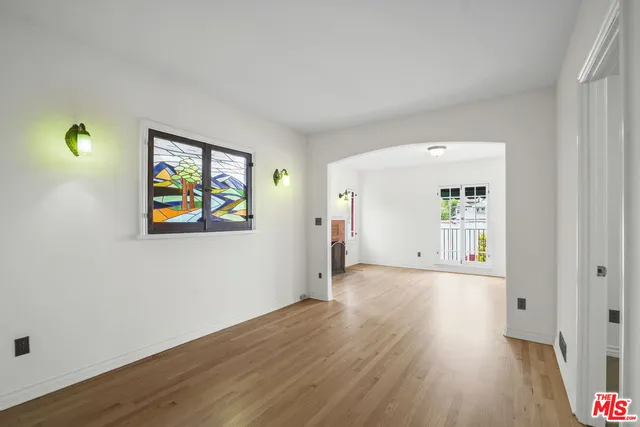 a bathroom with a shower a sink and a mirror