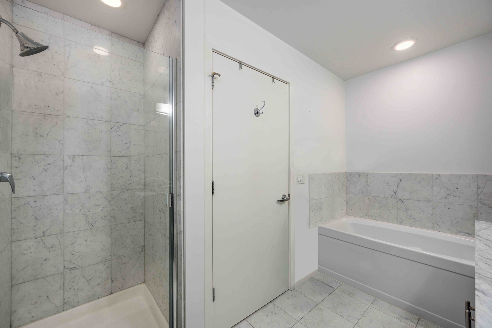 123 South Green Street, Unit 710B Chicago, IL 60607 - Photo 15 of 17 a bathroom with a bathtub and shower