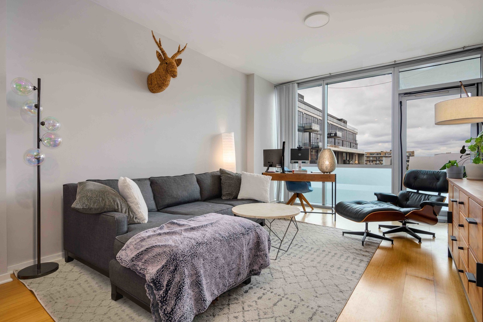 123 South Green Street, Unit 710B Chicago, IL 60607 - Photo 2 of 17 a living room with furniture and a rug