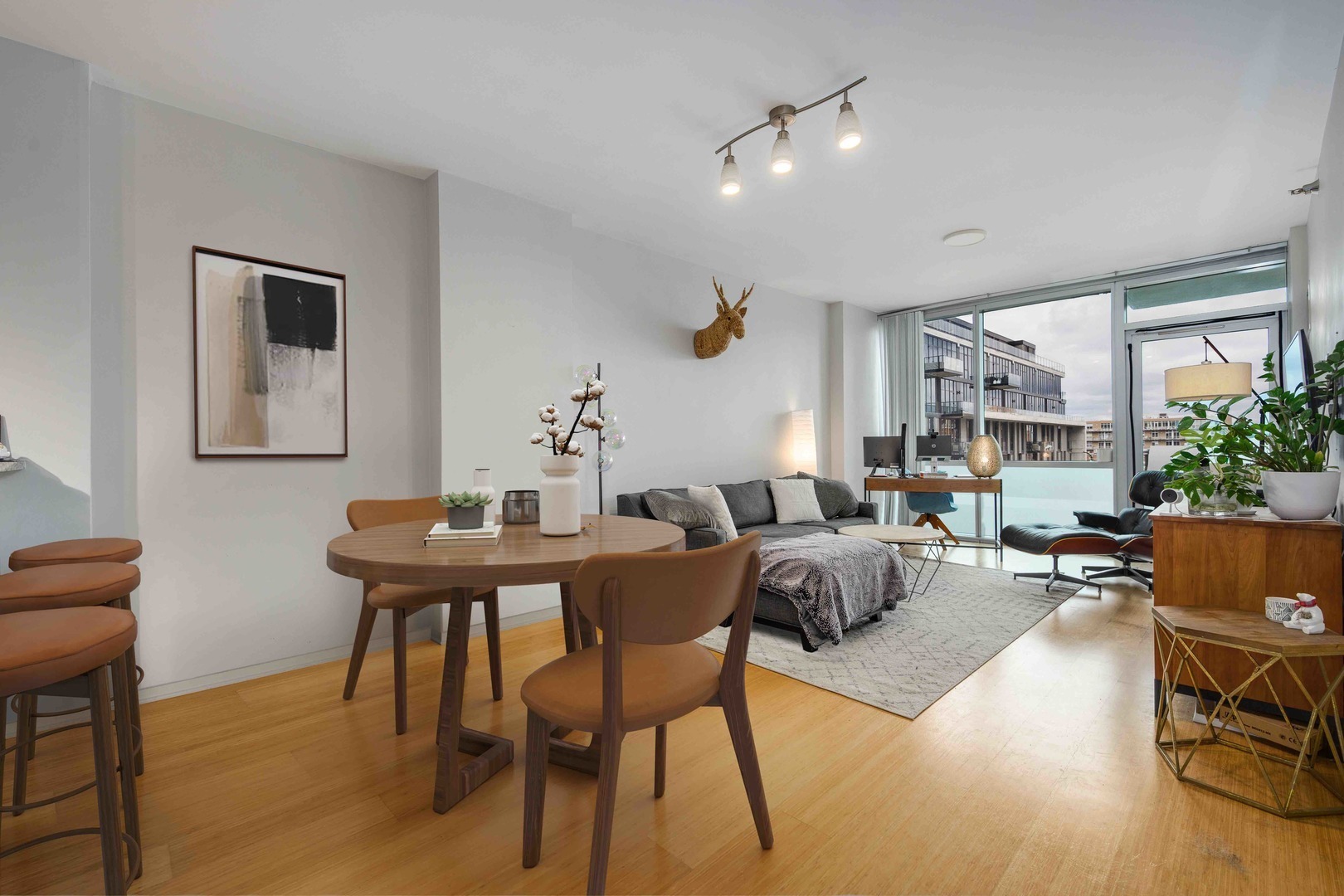 123 South Green Street, Unit 710B Chicago, IL 60607 - Photo 4 of 17 a view of a dining room with furniture and wooden floor