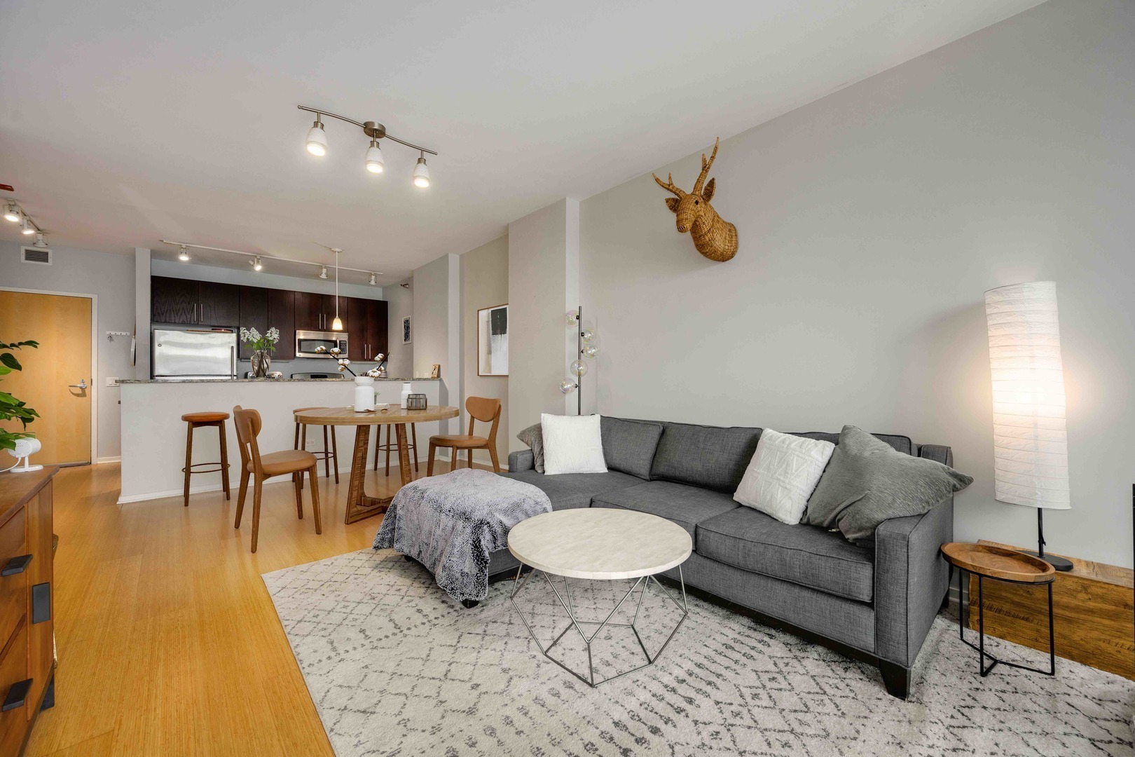 123 South Green Street, Unit 710B Chicago, IL 60607 - Photo 5 of 17 a living room with furniture and a table