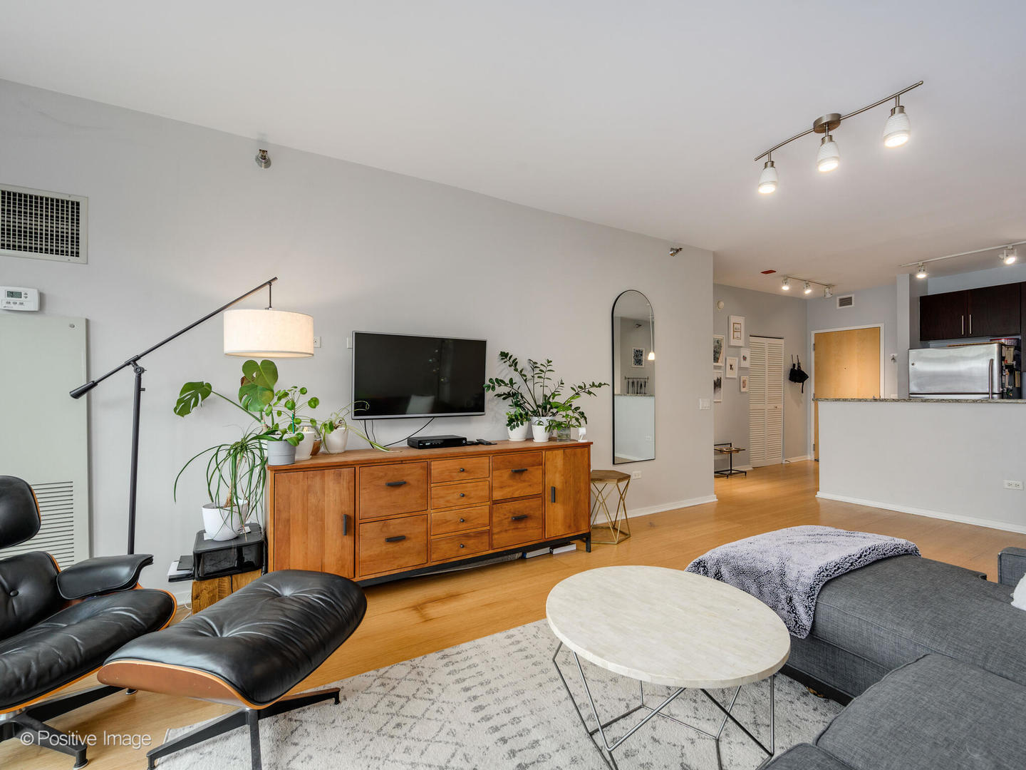 123 South Green Street, Unit 710B Chicago, IL 60607 - Photo 6 of 17 a living room with furniture and a flat screen tv
