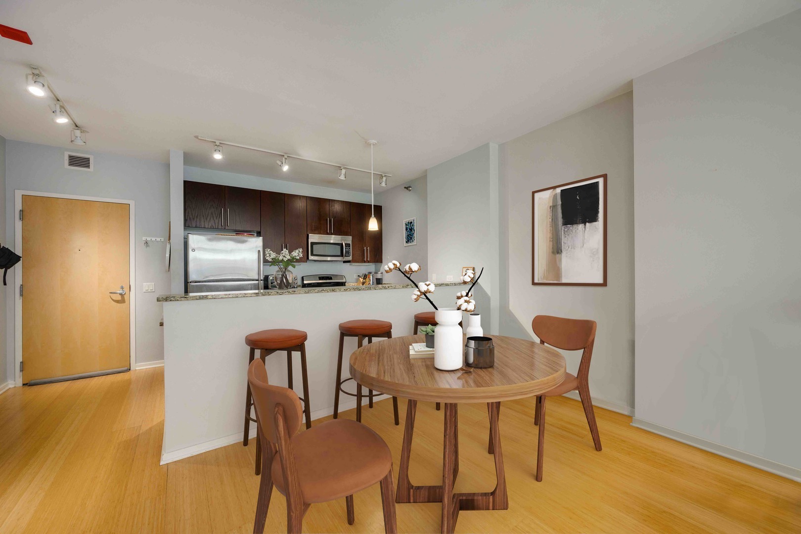 123 South Green Street, Unit 710B Chicago, IL 60607 - Photo 7 of 17 a dining room with furniture and wooden floor
