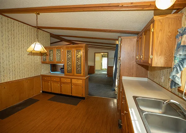 a kitchen with a sink and a refrigerator