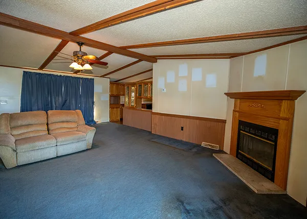 a bedroom with furniture and a fireplace