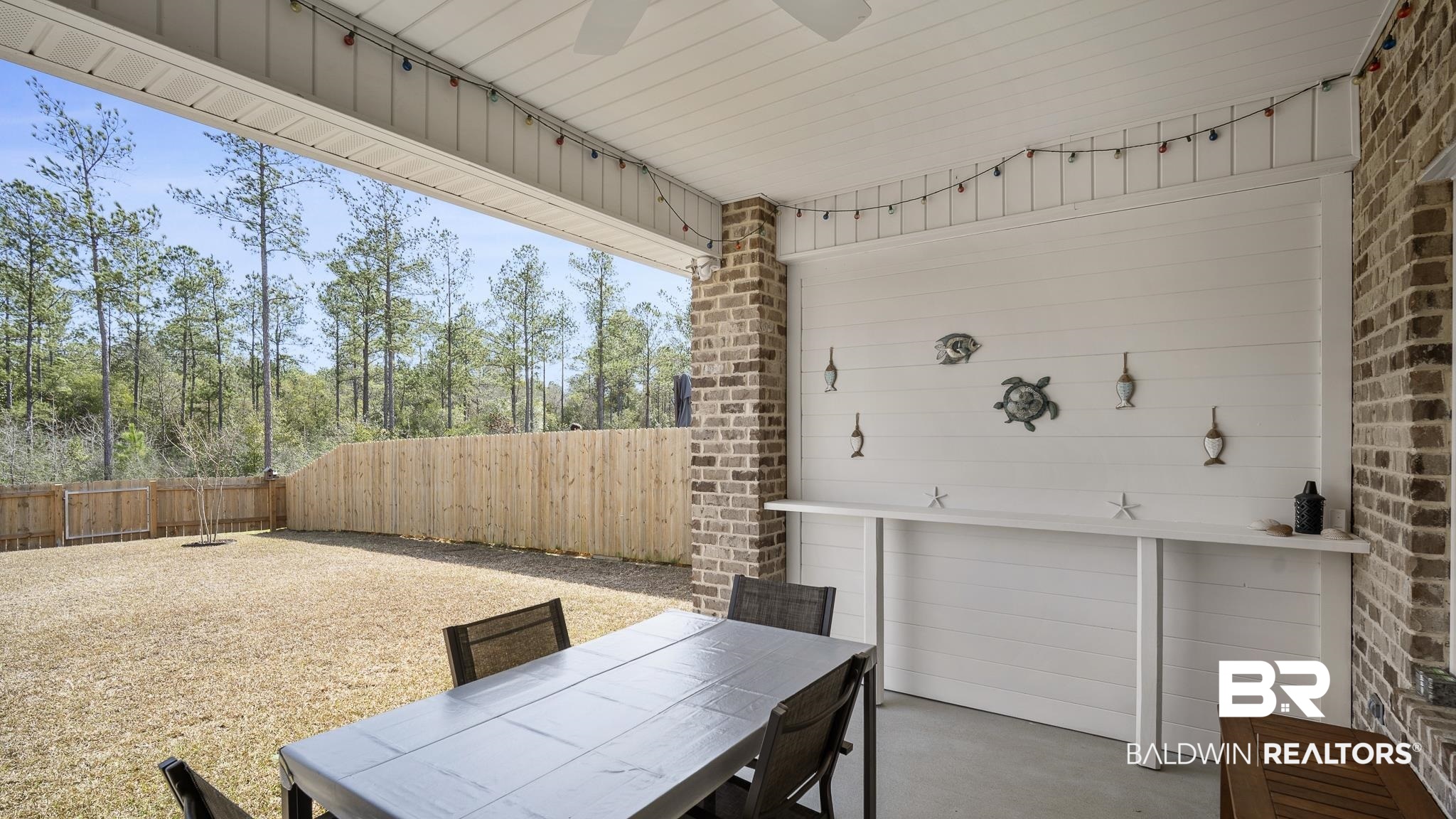 13887 Antler Hl Road Daphne, AL 36527 - Photo 24 of 50 Fenced backyard with a patio and outdoor dining area