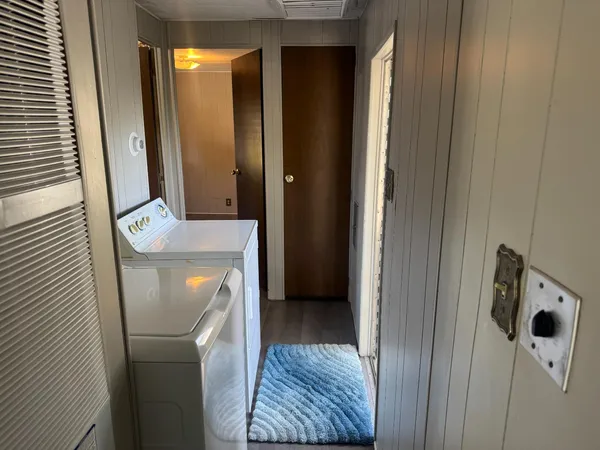 a view of hallway with washer and dryer