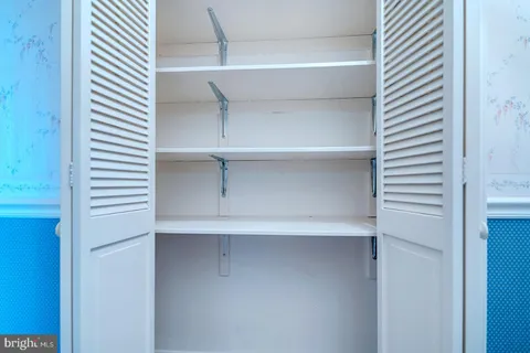 a bathroom with a bathtub sink and a window