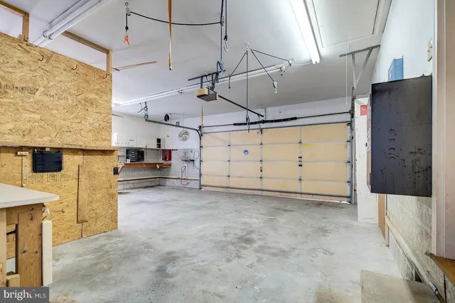 a view of a park with iron fence