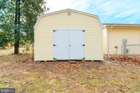 an aerial view of residential houses with yard