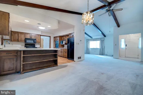 a kitchen with stainless steel appliances granite countertop a stove sink and cabinets
