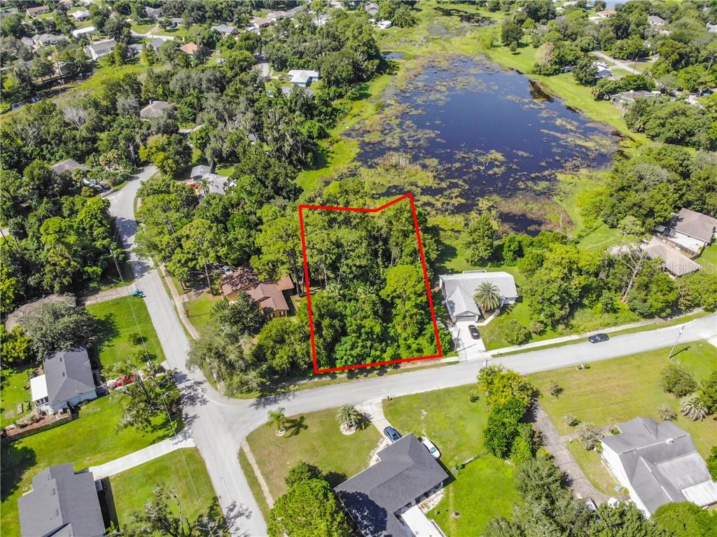 249 Angeles Road DeBary, FL 32713 - Photo 1 of 1 an aerial view of a house with a yard