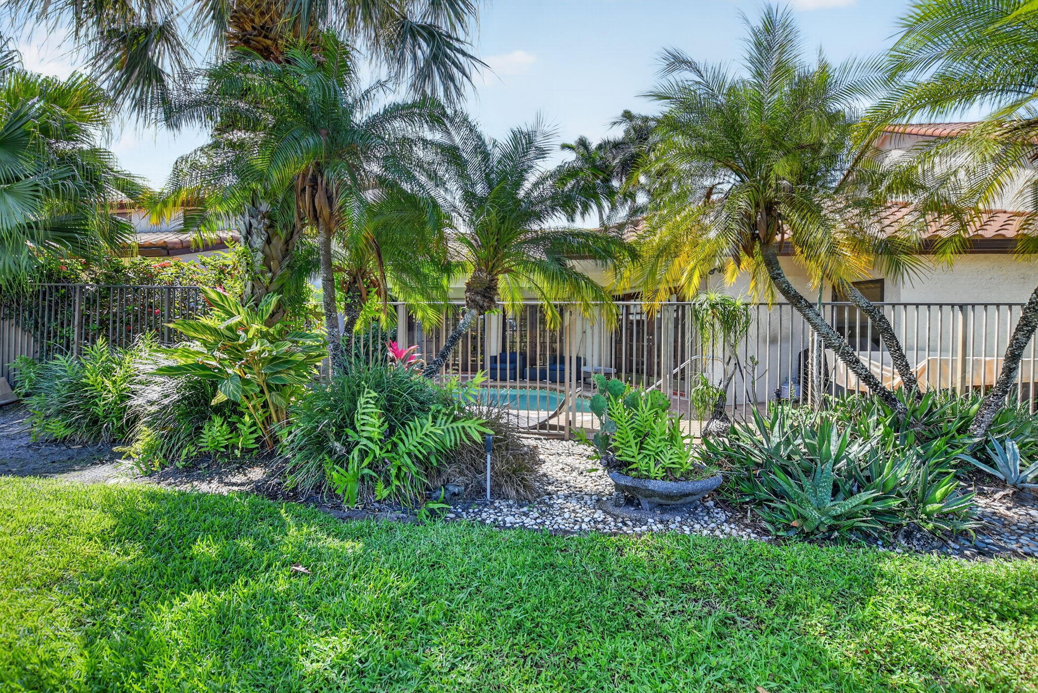 22519 Esplanada Circle, Unit W Boca Raton, FL 33433 - Photo 52 of 57 a front view of a house with a garden