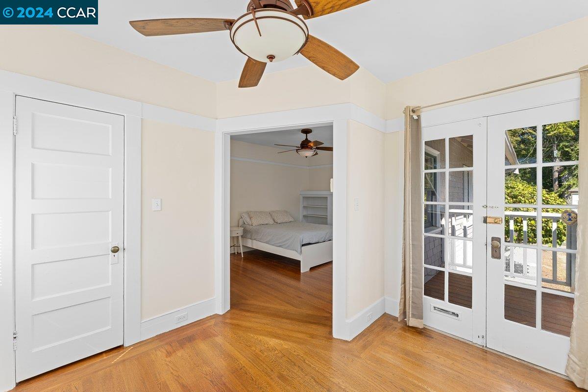 2820 Kelsey Street Berkeley, CA 94705 - Photo 17 of 23 a view of a livingroom with wooden floor and a ceiling fan
