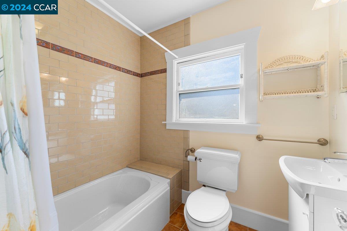 2820 Kelsey Street Berkeley, CA 94705 - Photo 22 of 23 a white toilet sitting next to a bath tub