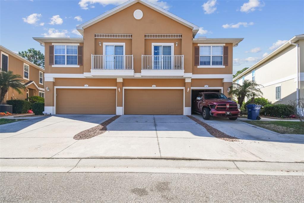 7626 Red Mill Circle New Port Richey, FL 34653 - Photo 1 of 1 a front view of a house with a yard and garage