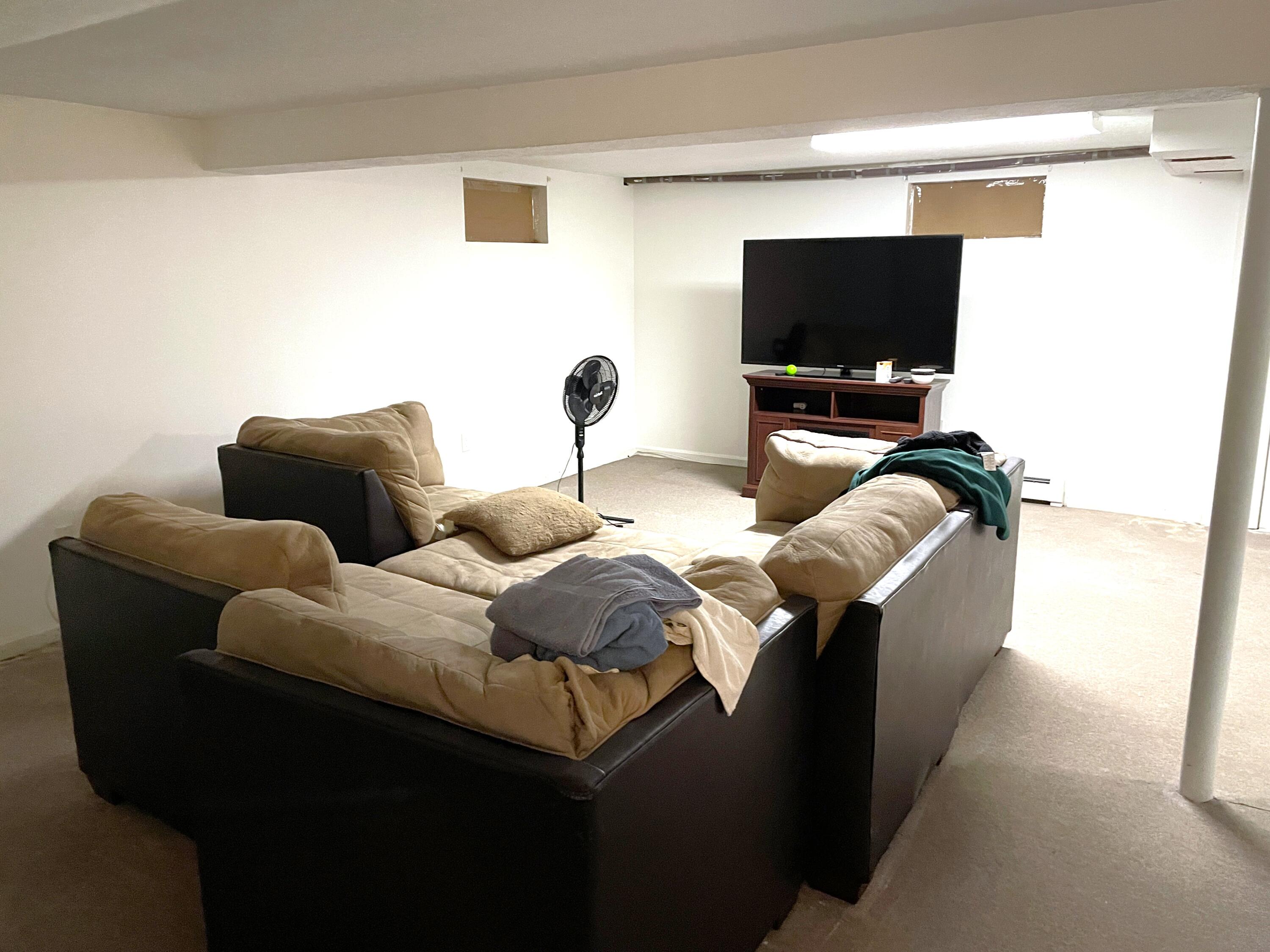 259 Great Marsh Road Centerville, MA 02632 - Photo 10 of 12 a living room with furniture and a flat screen tv