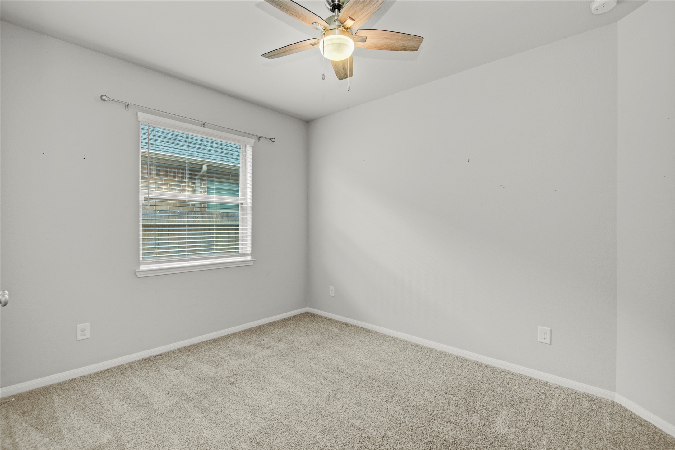 1314 Orchard Ridge Lane Tomball, TX 77375 - Photo 29 of 35 This secondary bedroom offers a bright layout with neutral tones and flexibility for guests, family, or a home office.