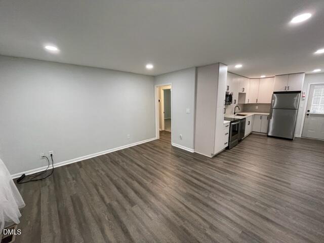 4804 Hoyle Drive, Unit A Raleigh, NC 27604 - Photo 6 of 19 a view of a kitchen with a sink and a refrigerator