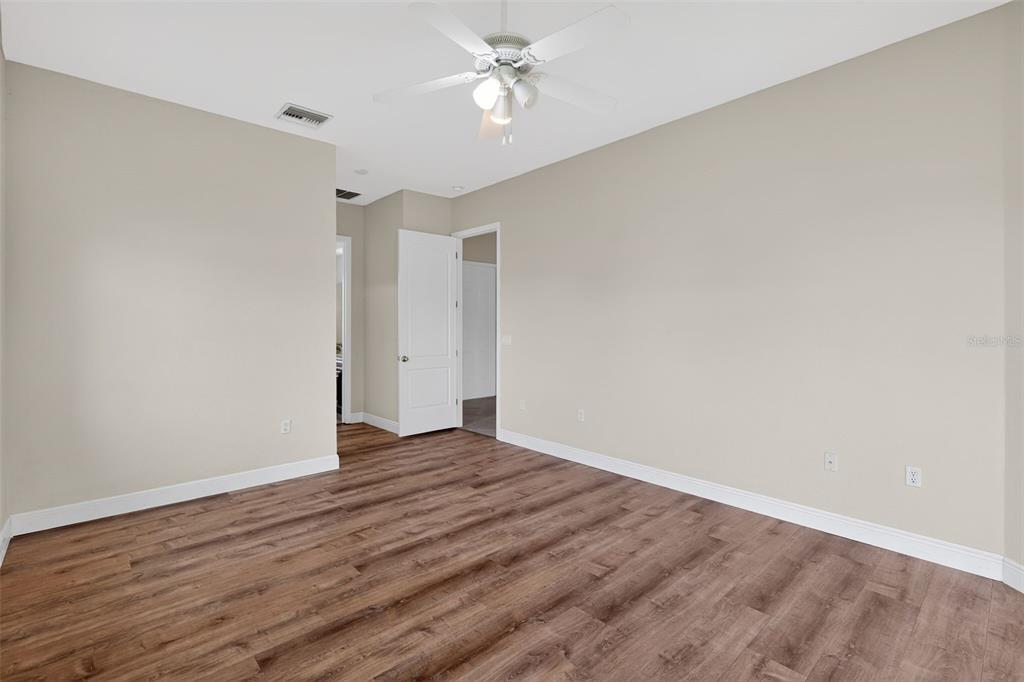 1216 Heavitree Court Sebring, FL 33876 - Photo 11 of 35 wooden floor in an empty room