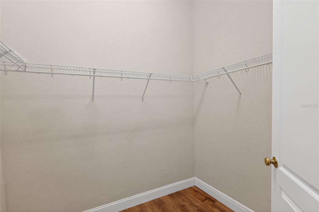 1216 Heavitree Court Sebring, FL 33876 - Photo 26 of 35 a view of a room with racks on the wall