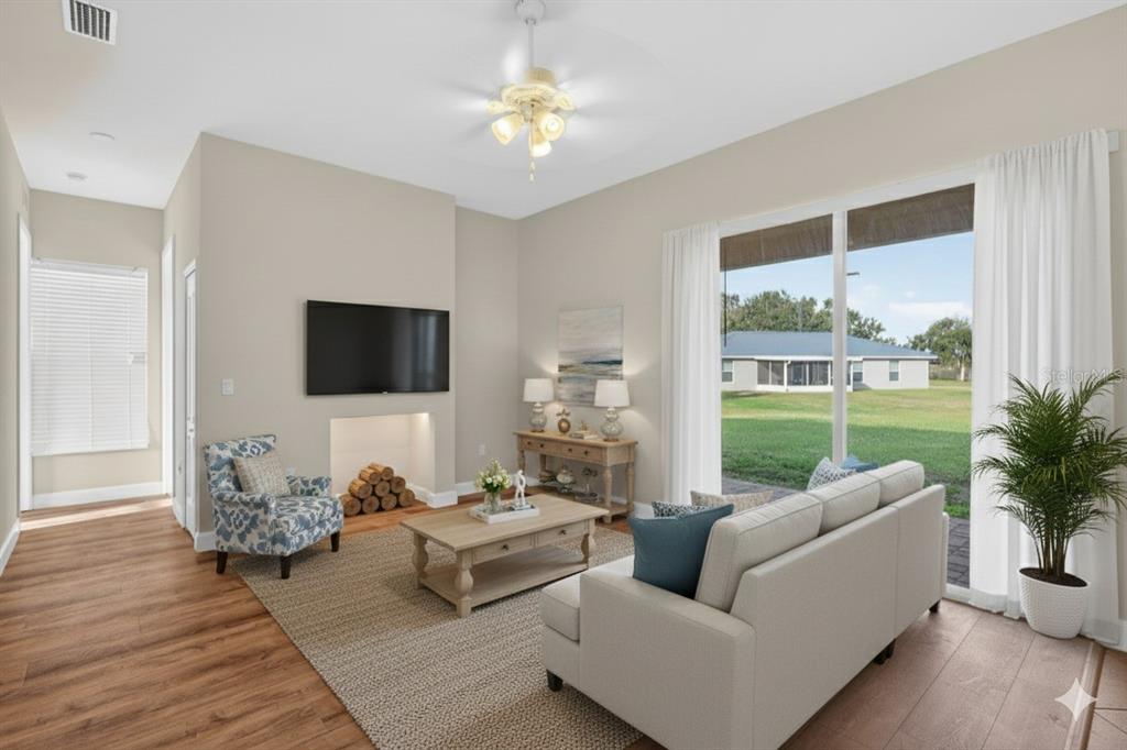 1216 Heavitree Court Sebring, FL 33876 - Photo 4 of 35 a living room with furniture and a flat screen tv