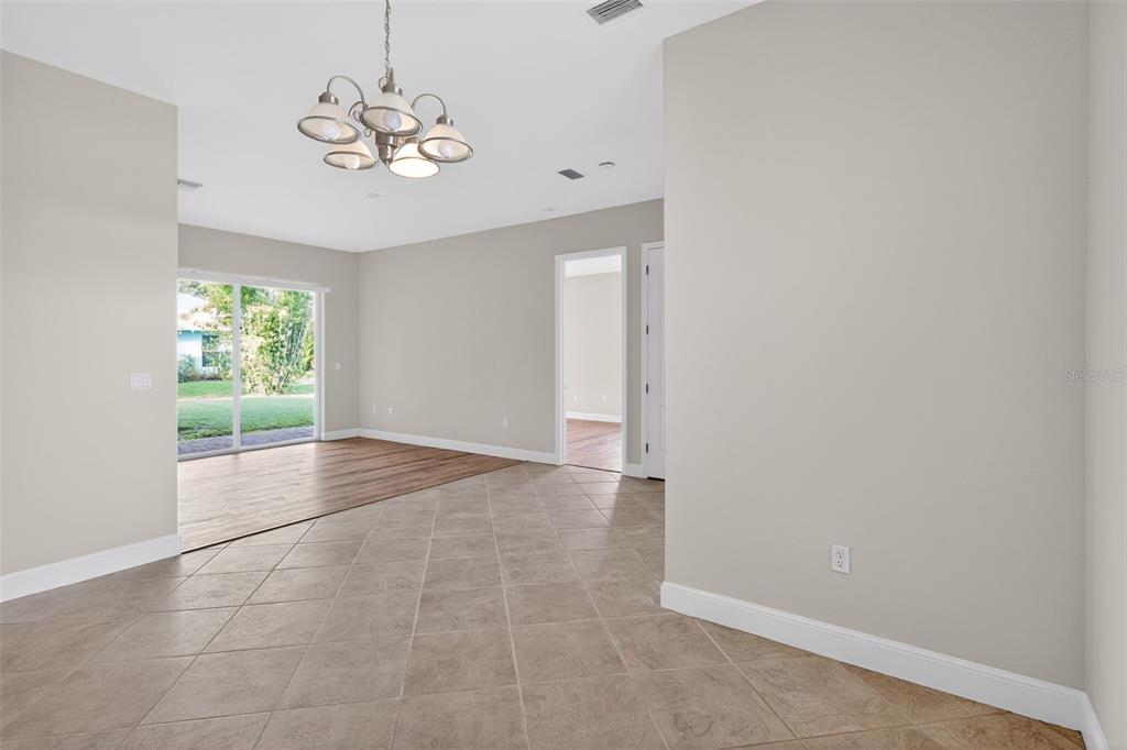 1216 Heavitree Court Sebring, FL 33876 - Photo 5 of 35 a view of an empty room with a window