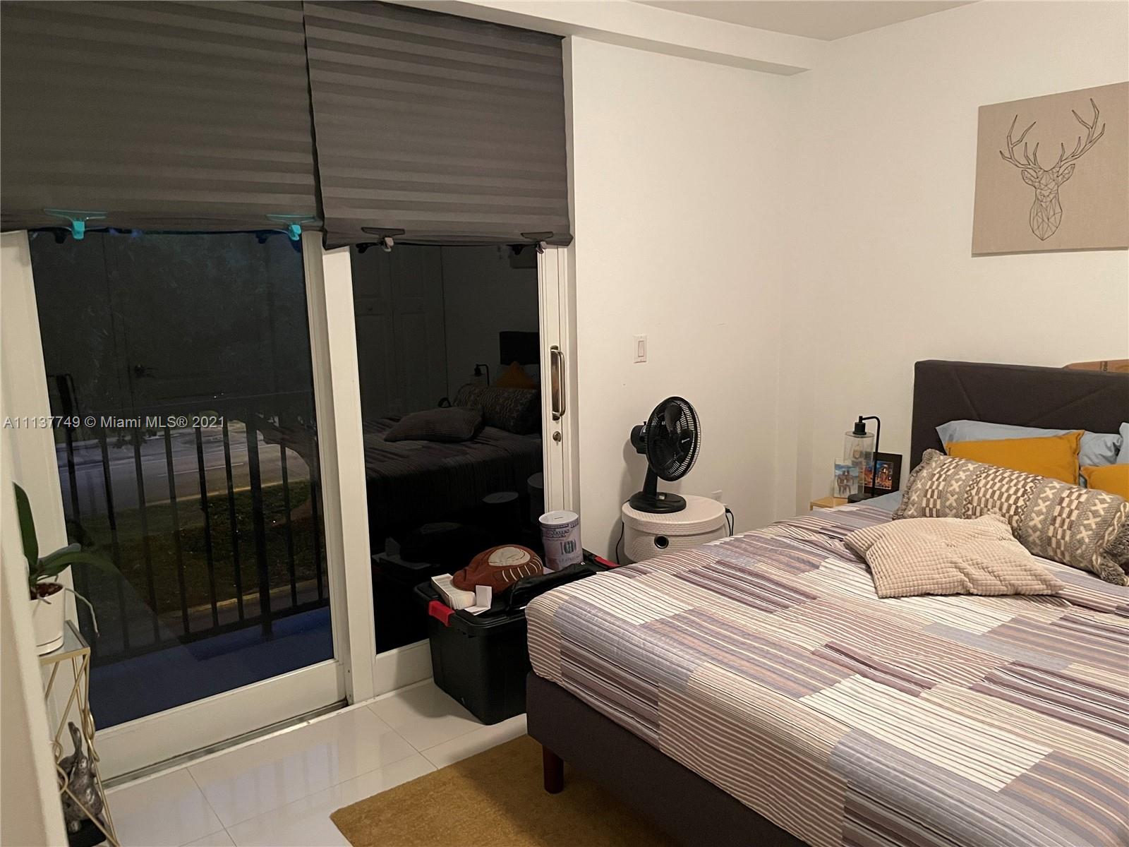 2701 Southwest 3rd Avenue, Unit 202 Miami, FL 33129 - Photo 11 of 26 a bedroom with a bed and a window
