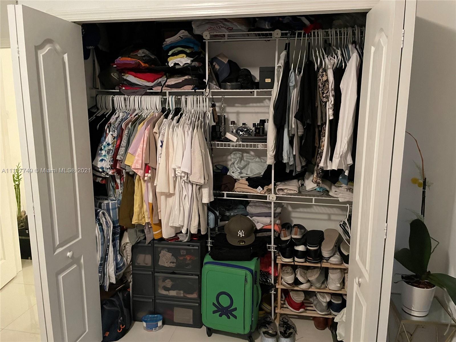 2701 Southwest 3rd Avenue, Unit 202 Miami, FL 33129 - Photo 13 of 26 a view of walk in closet with clothes and shoes
