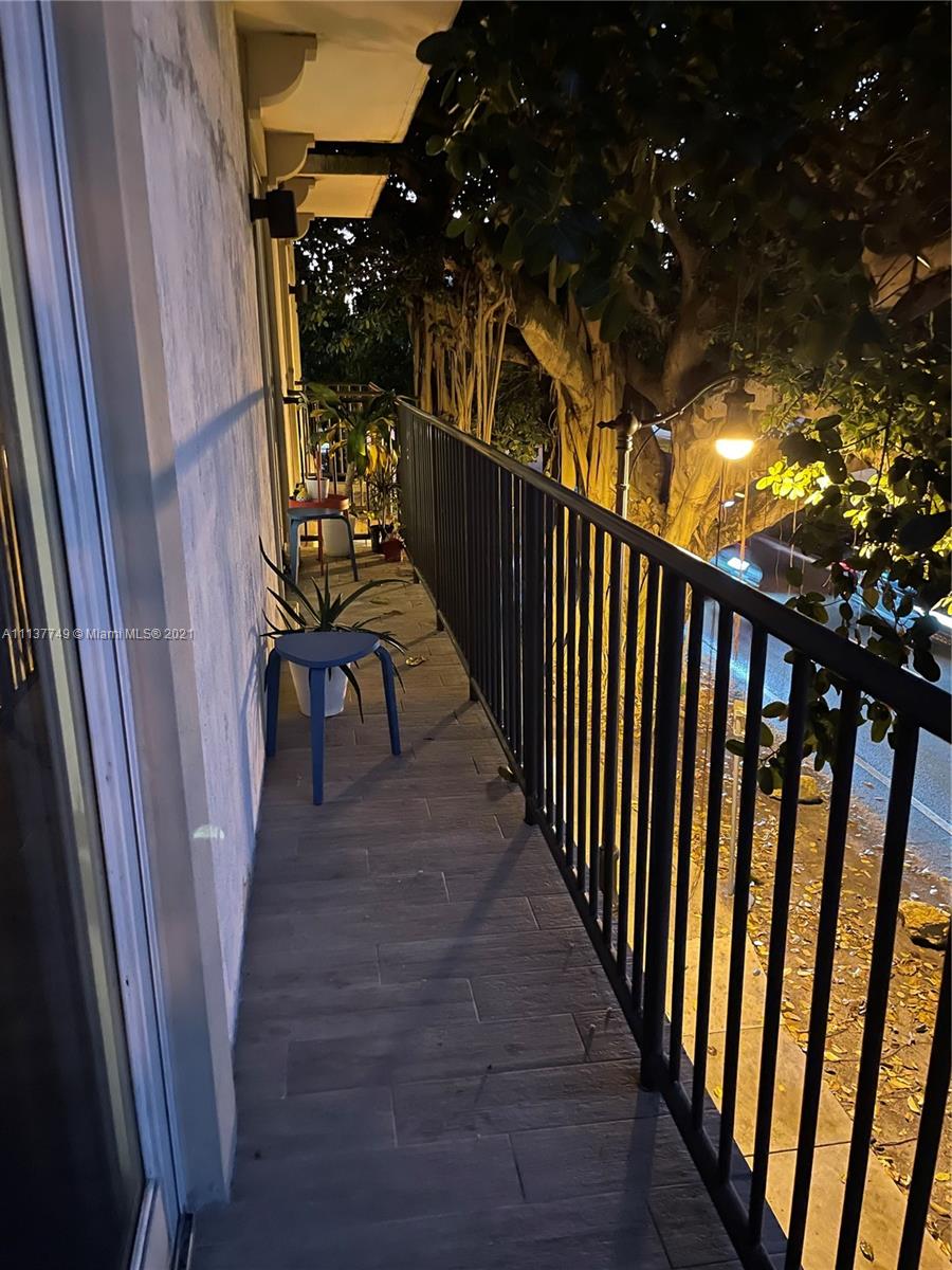 2701 Southwest 3rd Avenue, Unit 202 Miami, FL 33129 - Photo 16 of 26 a view of balcony with wooden floor and outdoor seating