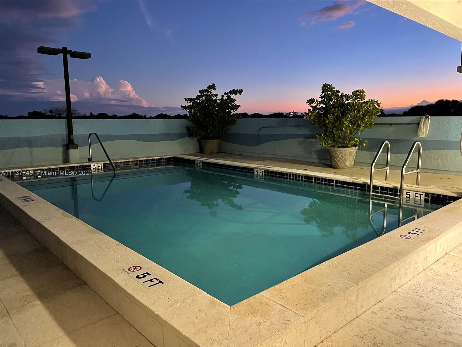 2701 Southwest 3rd Avenue, Unit 202 Miami, FL 33129 - Photo 20 of 26 a view of a swimming pool with a yard