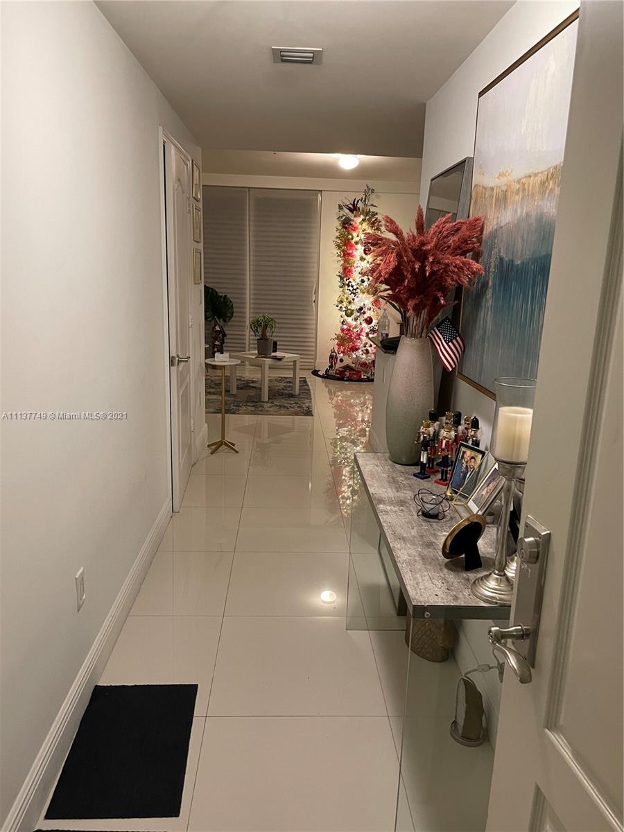 2701 Southwest 3rd Avenue, Unit 202 Miami, FL 33129 - Photo 7 of 26 a living room with furniture and a potted plant