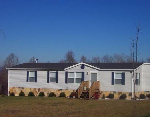 445 Greenway Road Glade Hill, VA 24092 - Photo 1 of 1 a front view of a house with a yard