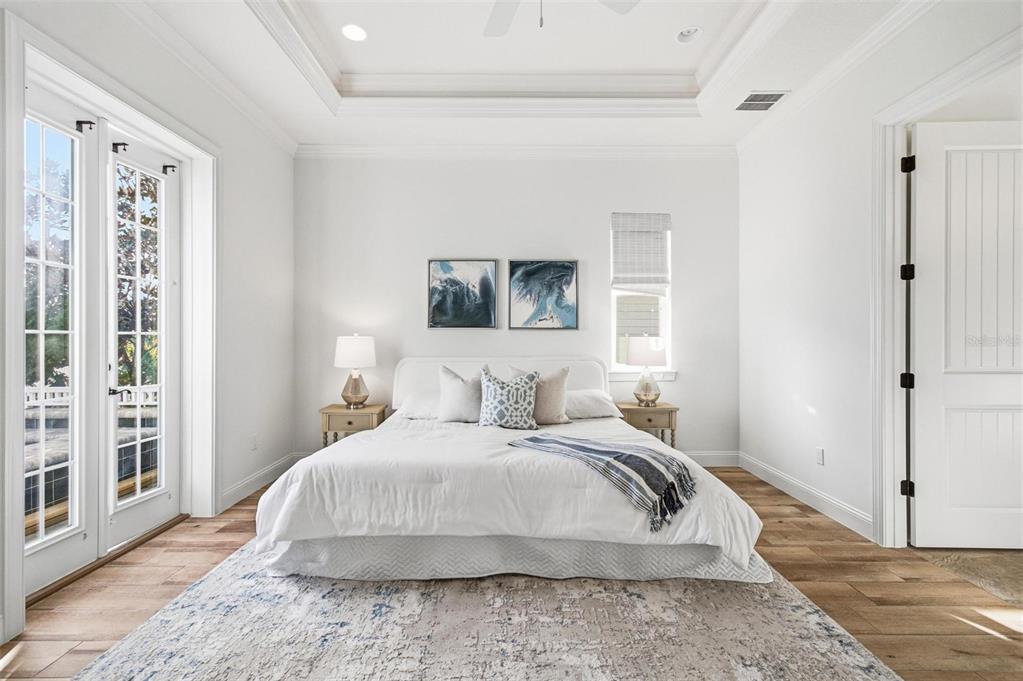 25 Sandy Beach Way Palm Coast, FL 32137 - Photo 16 of 41 a bedroom with a large bed and a window