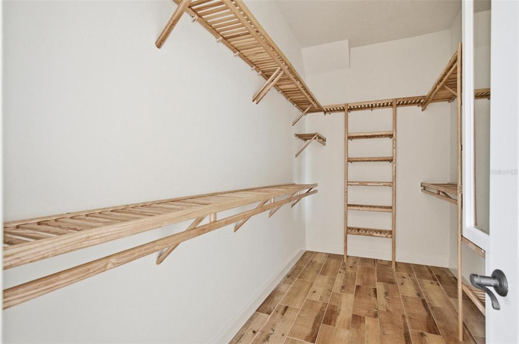 25 Sandy Beach Way Palm Coast, FL 32137 - Photo 19 of 41 a view of a room with stairs and wooden floor