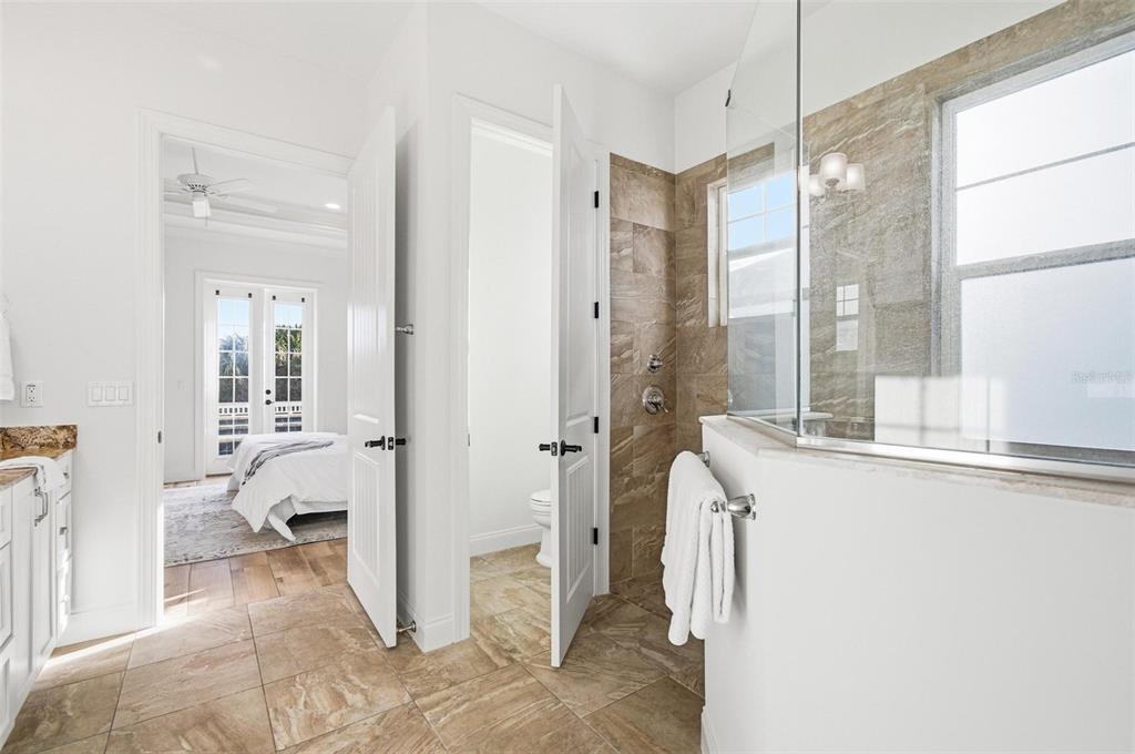 25 Sandy Beach Way Palm Coast, FL 32137 - Photo 20 of 41 a view of a bathroom with tub and windows