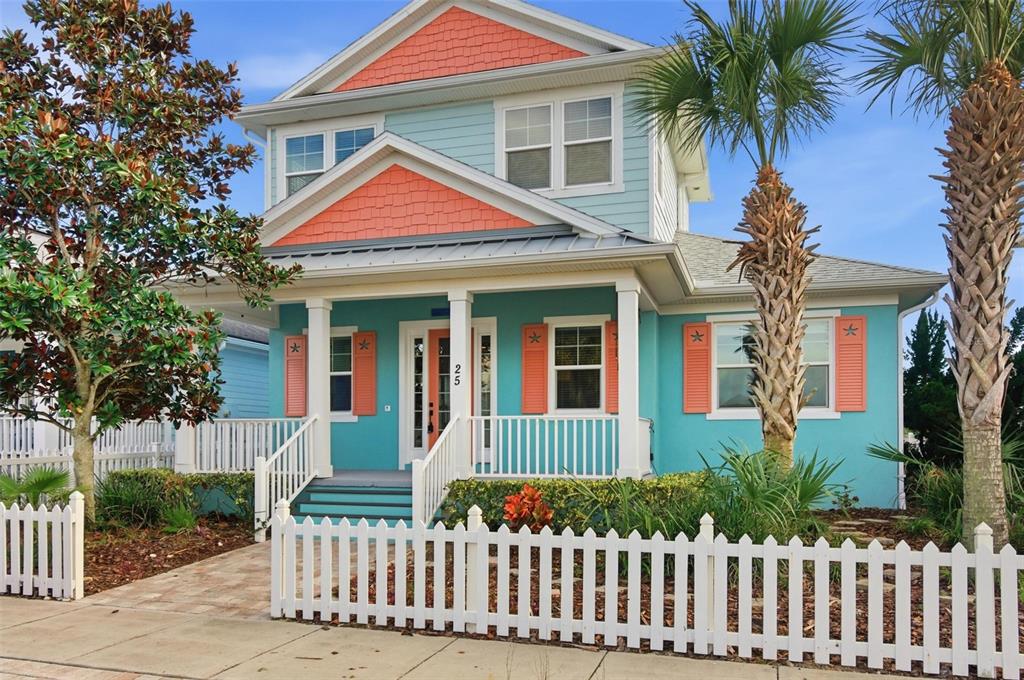 25 Sandy Beach Way Palm Coast, FL 32137 - Photo 2 of 41 a front view of a house with a garden