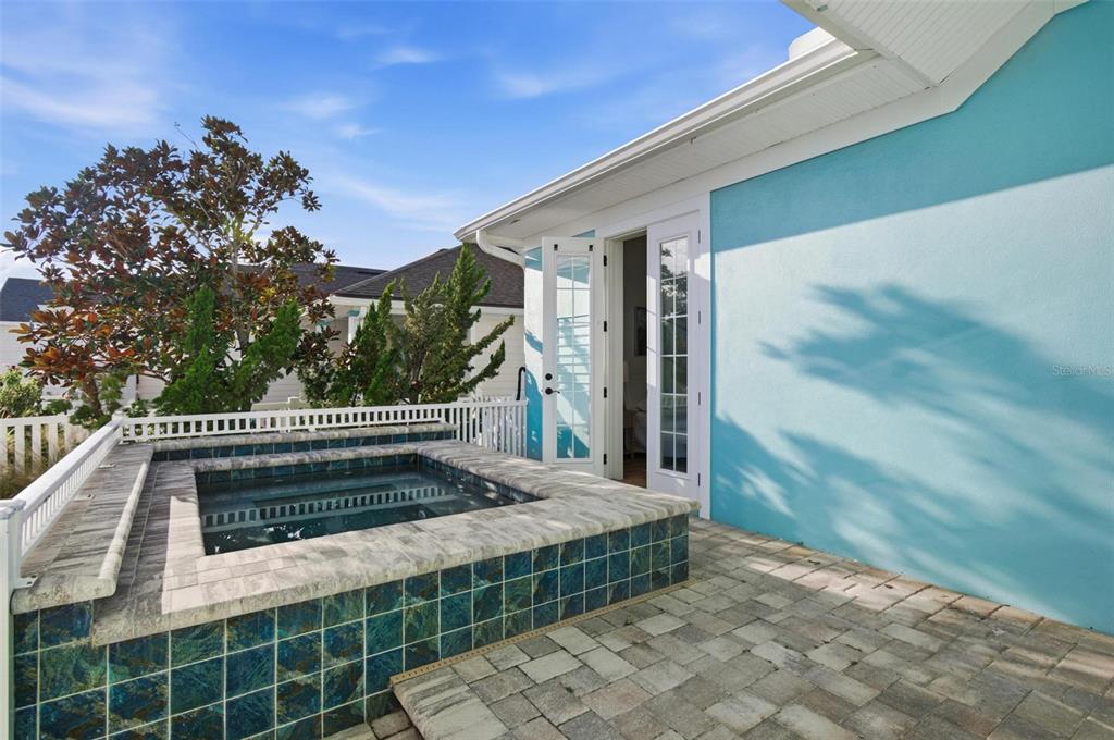 25 Sandy Beach Way Palm Coast, FL 32137 - Photo 22 of 41 a view of a porch with a floor to ceiling window