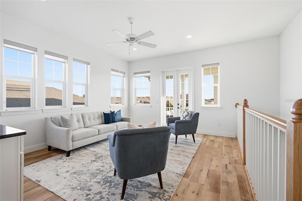 25 Sandy Beach Way Palm Coast, FL 32137 - Photo 27 of 41 a living room with furniture and wooden floor