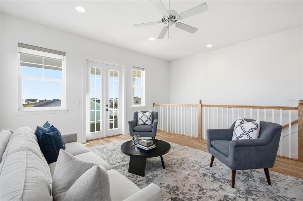 25 Sandy Beach Way Palm Coast, FL 32137 - Photo 28 of 41 a living room with furniture and a large window