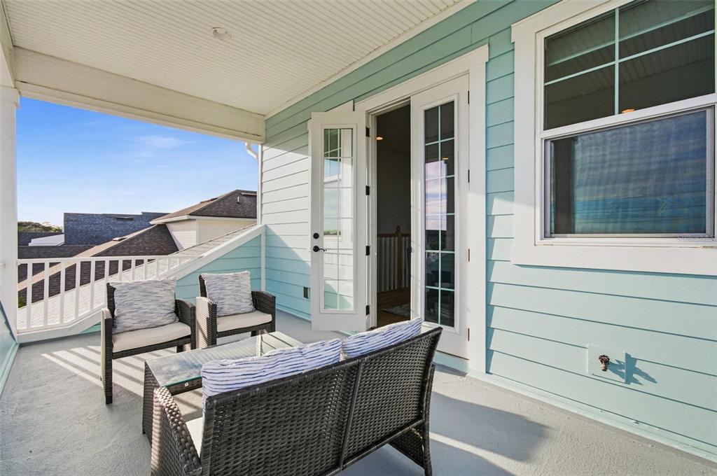 25 Sandy Beach Way Palm Coast, FL 32137 - Photo 30 of 41 a balcony with table and chairs