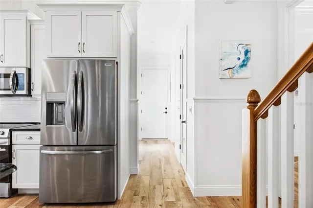 a view of kitchen with wooden floor