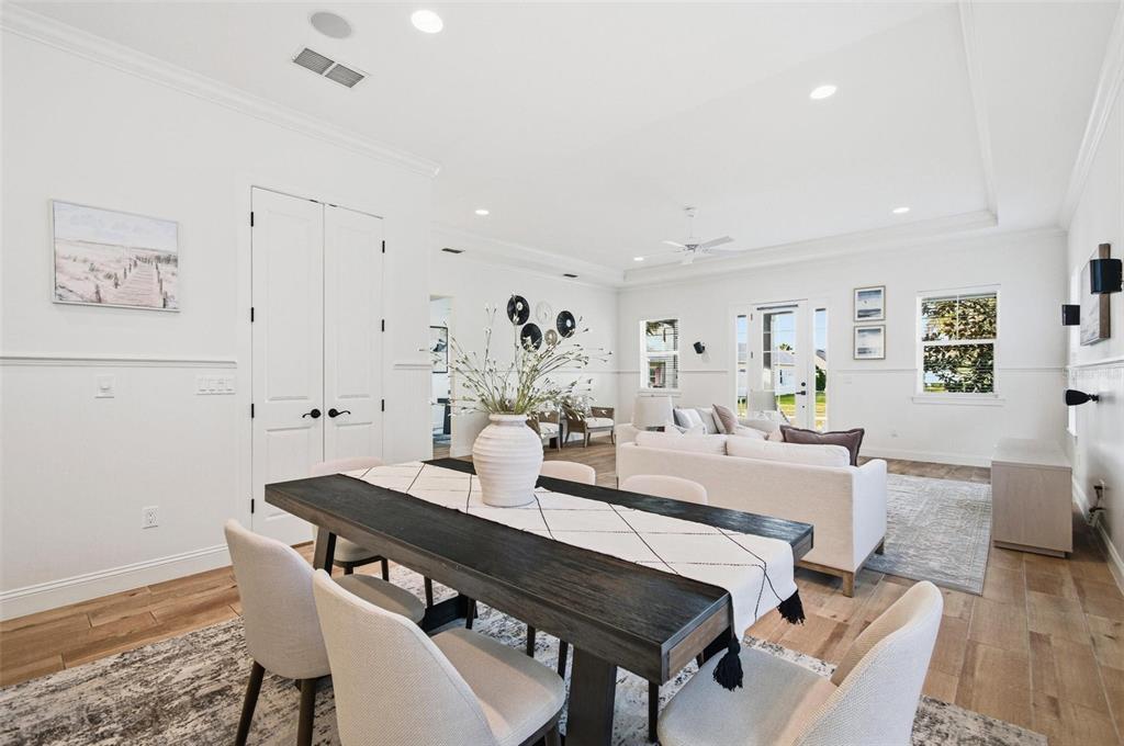 25 Sandy Beach Way Palm Coast, FL 32137 - Photo 10 of 41 a view of a dining room with furniture and wooden floor
