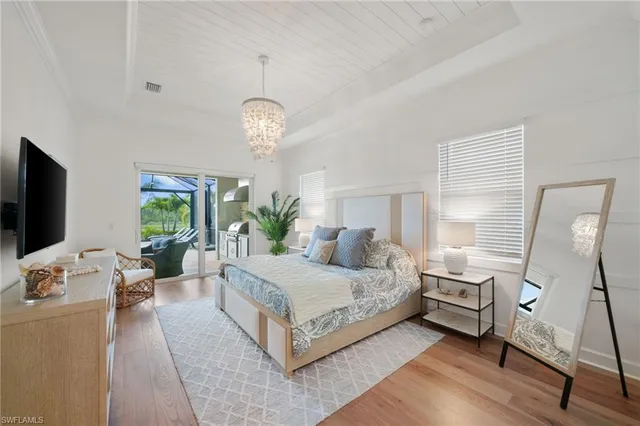 a living room with furniture a rug and white walls