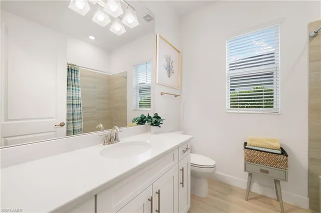 a bedroom with a bed and a chair